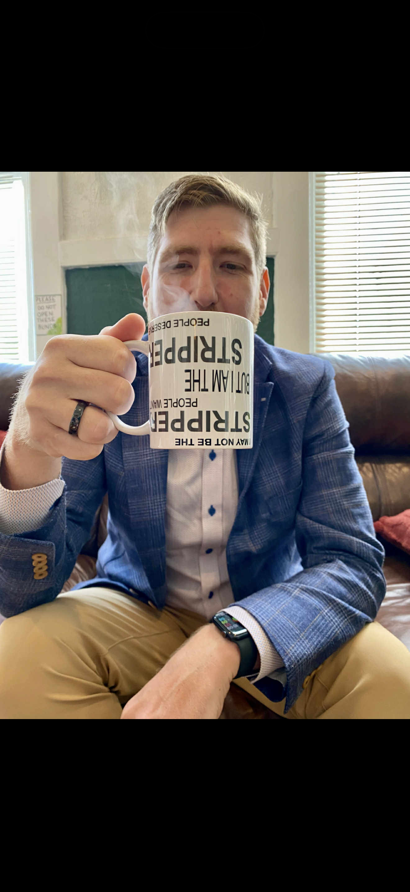 Person enjoying their Stripper Mug